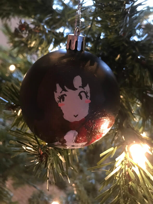 A painting of nakuru akizuki from cardcaptor sakura on a black ornament